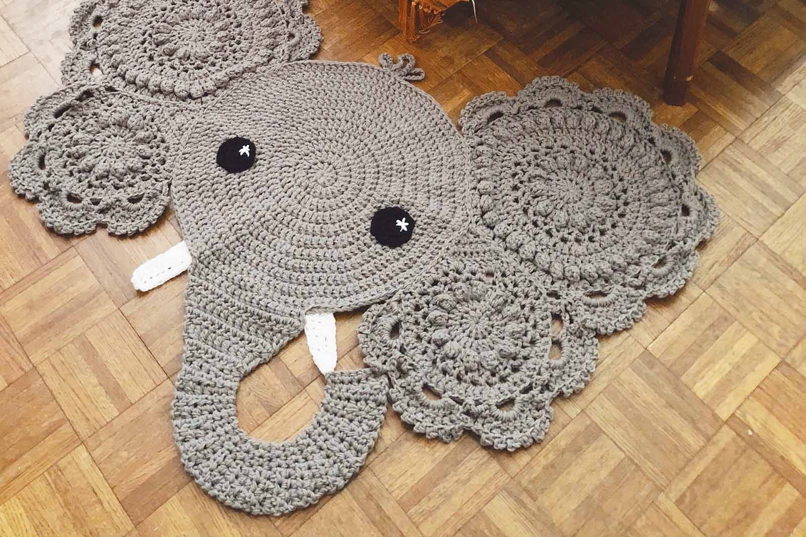 Beautiful handcrafted rug made with crochet techniques in a bedroom.